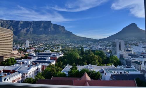 a view of cape town with table mountain in the background at Taj Cape Town in Cape Town