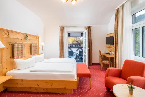 Ένα ή περισσότερα κρεβάτια σε δωμάτιο στο Hotel Tannenhof