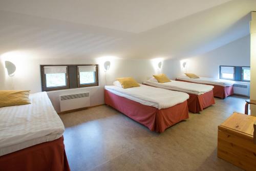 En eller flere senge i et værelse på Holiday Club Rukatunturi Apartments