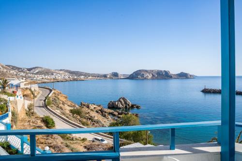 a view of the ocean from a balcony at Arhontiko Hotel in Foinikion