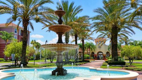 a fountain in a park with palm trees at 4024 Breakview Drive 303 in Orlando