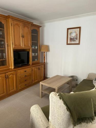 a living room with a couch and a table at Casa Carmen in Candeleda