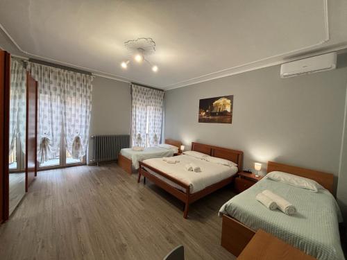 Letto o letti in una camera di DOMUS Hotel