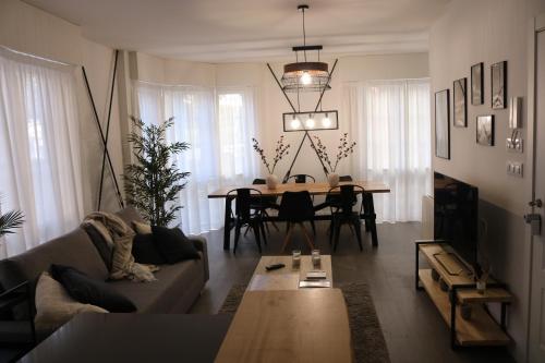 a living room with a couch and a table at Apartamento en Ferrol in Ferrol