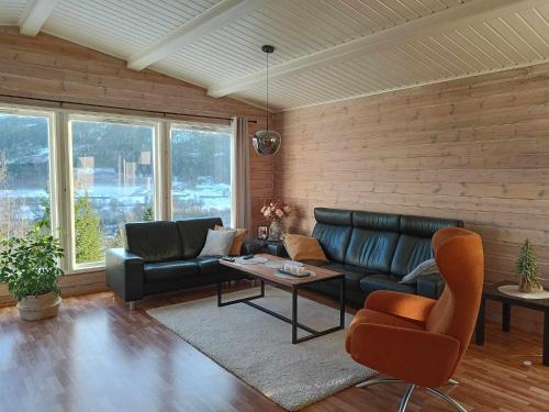 a living room with a couch and a table at Holiday home in Steinkjer in Steinkjer