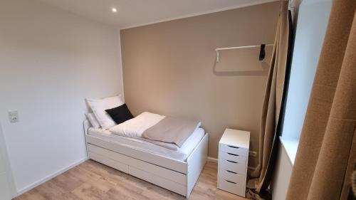 a small bedroom with a small bed in it at Top Wohnung in Göttingen in Göttingen