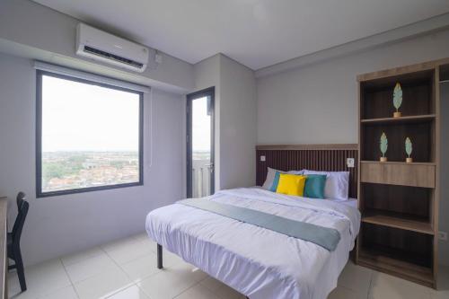 Postel nebo postele na pokoji v ubytování Apartemen Riverdale Cikarang By Abdihome