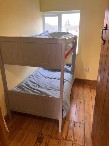 a bunk bed in a room with a window at The Old Warwick House in Warwick