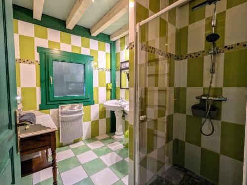 a bathroom with a sink and a shower at Chalet cosy avec spa et sauna, animaux admis - FR-1-589-673 in Fresse-sur-Moselle
