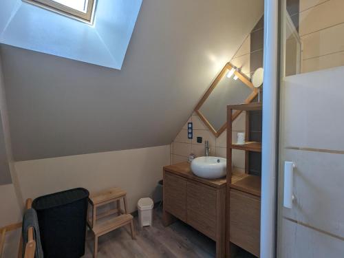 a bathroom with a sink and a staircase at Maison spacieuse et contemporaine avec parking, vélos et baby-foot en Berry - FR-1-591-649 in Neuvy-Saint-Sépulchre