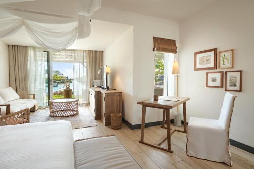 Ένα ή περισσότερα κρεβάτια σε δωμάτιο στο Paradise Cove Boutique Hotel (Adults Only)