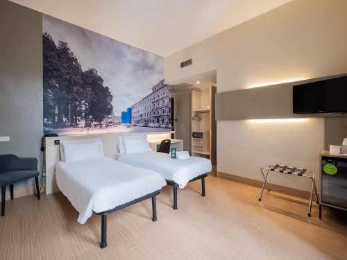 Postel nebo postele na pokoji v ubytování B&B Hotel Trieste