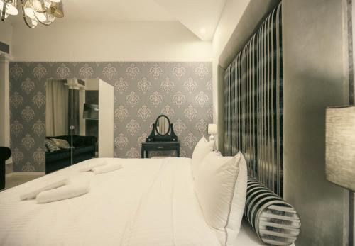 Postel nebo postele na pokoji v ubytování Sliema Central Iprime Suites