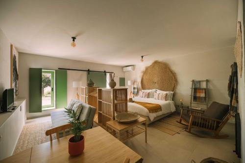 a living room with a couch and a table at Vila Coura in Amarante