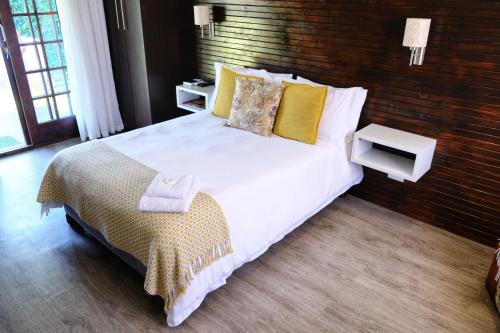 Ένα ή περισσότερα κρεβάτια σε δωμάτιο στο White Swan Guesthouse