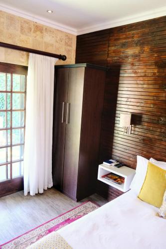 Ένα ή περισσότερα κρεβάτια σε δωμάτιο στο White Swan Guesthouse