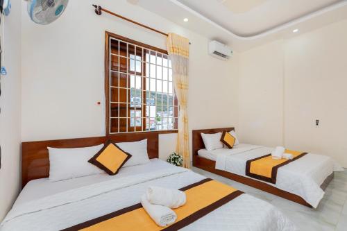 Postel nebo postele na pokoji v ubytování Homestay Bãi Sau - 5 phòng ngủ - 30 Võ Thị Sáu - Free karaoke