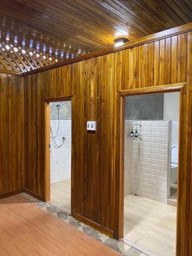a bathroom with a shower and a toilet in a room at ห้างหุ้นส่วนจำกัด บ้านเถ้าแก่ in Ban Muang Baeng