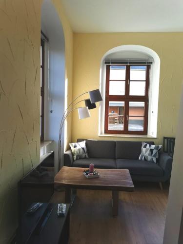 a living room with a couch and a coffee table at Schnorr-Villa in Schneeberg