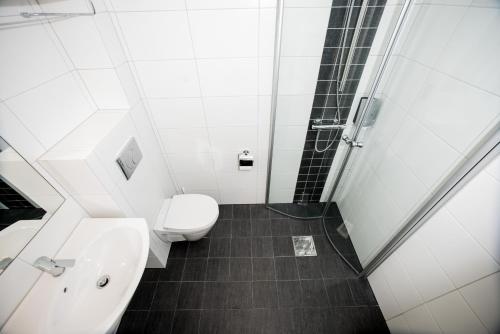 a bathroom with a toilet and a sink at Geilo Hotel in Geilo