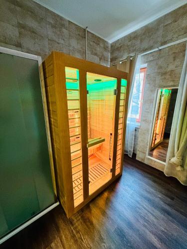 a wooden door is open in a room at Villa Vitti's - Verona est in San Martino Buon Albergo