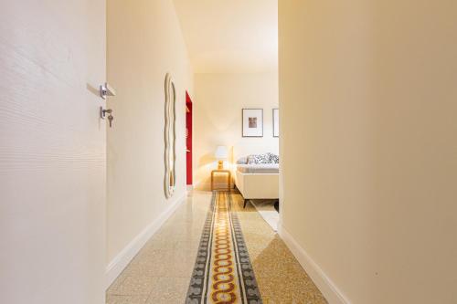 a hallway with a room with a bed at DomusFebo SanGiovanniSuites in Rome