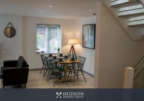 a dining room with a table and chairs at Ironbridge Home with Roof Terrace in Ironbridge