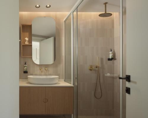 a bathroom with a sink and a shower at Paligremnos Infinity - Adults only in Plakias