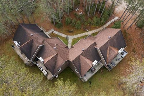 an overhead view of a house with a roof at Le Champetre Tremblant 2bdrs Condo W Fireplace in Mont-Tremblant