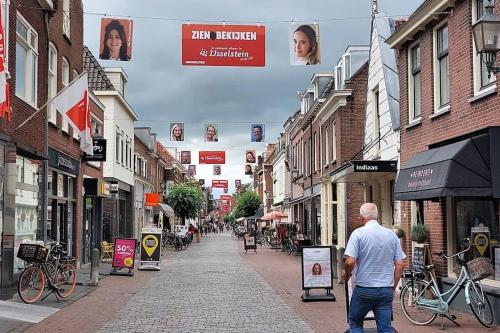 a man walking down a street in a city at Trek-in in IJsselstein
