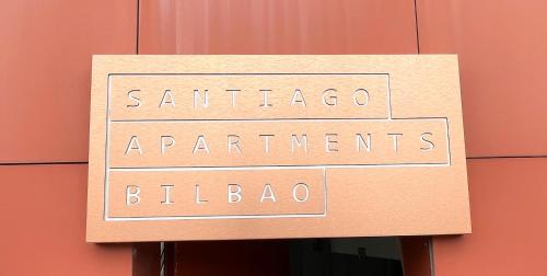 a sign that says santander apartments bilba at Santiago Apartments Bilbao in Bilbao