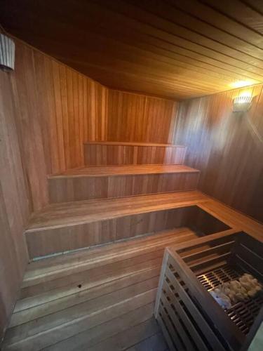 an empty sauna with wooden walls and wooden floors at Hotel Biena Sena Madureira PqIbirapuera Com Garagem 907 in Sao Paulo