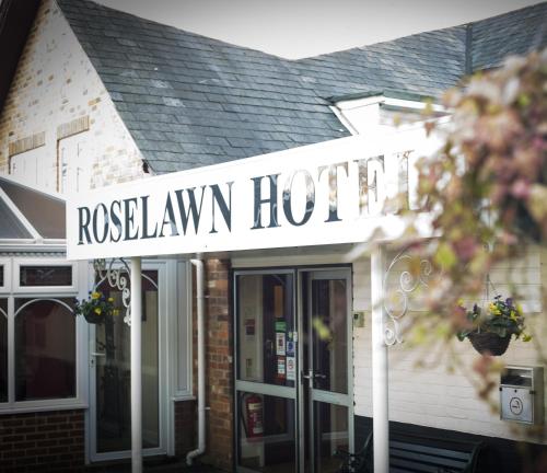 a hotel sign on the front of a building at Roselawn Hotel in Reading