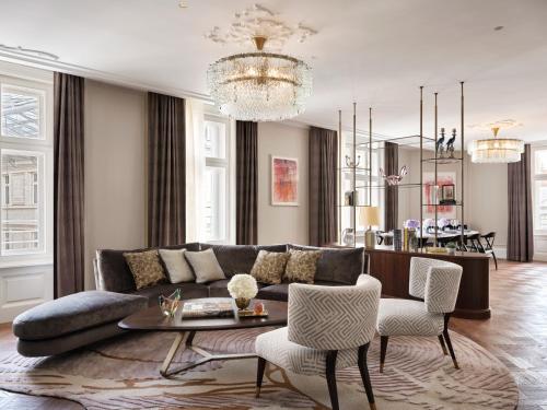 a living room with a couch and a table at Rosewood Vienna in Vienna