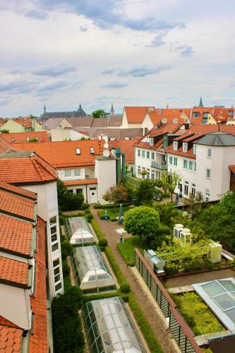 a view of a city with many windows and roofs at Hotel Alma Am Anger in Erfurt
