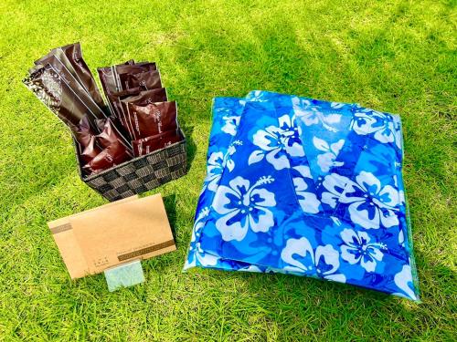 two boxes of chocolates and a box of chocolate on the grass at Ducale Garden Hotel Kujukuri in Kujukuri