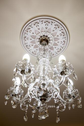 a silver chandelier hanging from a ceiling at Hotel Stil in Cluj-Napoca
