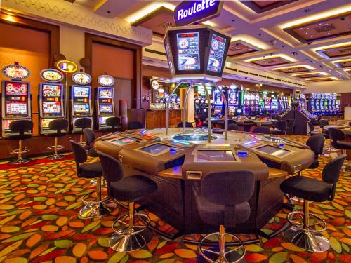 a casino with a bunch of slot machines at Park, Hotel & Entertainment in Nova Gorica