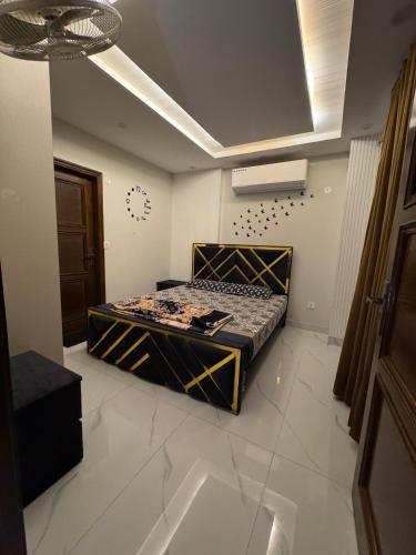 a bedroom with a bed in a room at Mehar Heights in Rāmkot
