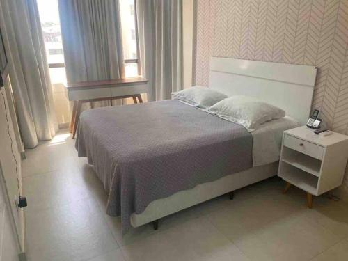 Ένα ή περισσότερα κρεβάτια σε δωμάτιο στο Flat mobiliado ap 25 Campinas - SP