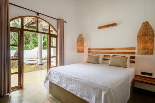 Ένα ή περισσότερα κρεβάτια σε δωμάτιο στο golden elephant villa