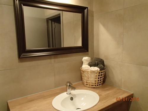 a bathroom with a sink and a mirror at FLY in POPS in Poperinge