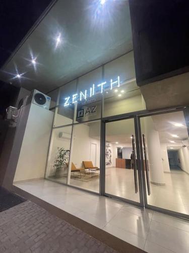a store front of a building with a sign on it at Apartamento con pileta en Asunción centro in Asuncion