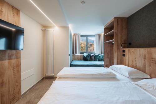 Postel nebo postele na pokoji v ubytování Residence Piz Aot