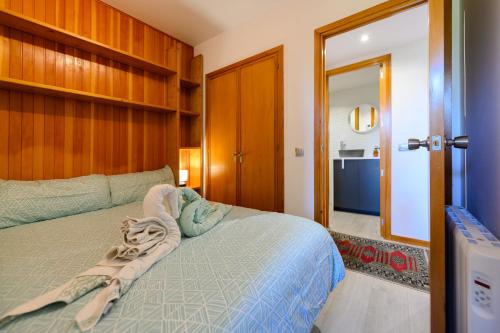 Ένα ή περισσότερα κρεβάτια σε δωμάτιο στο Comodo Apartamento Esquia y Relájate en La Pinilla