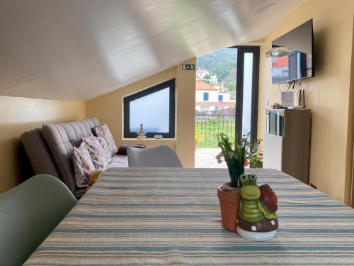 En eller flere senge i et værelse på Casinha Gomes