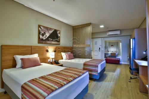 Postel nebo postele na pokoji v ubytování Flat & Lounge SQUARE FARIA LIMA