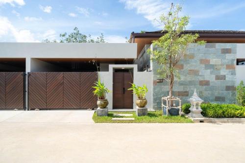 a rendering of a house with a driveway at Wilawan villas in Phuket Town