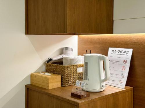 a kitchen counter with a coffee maker on it at Gurida Bupyeong in Incheon
