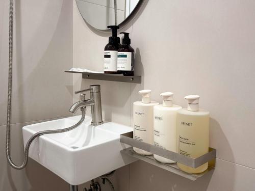 a bathroom with a sink and a mirror at Gurida Bupyeong in Incheon